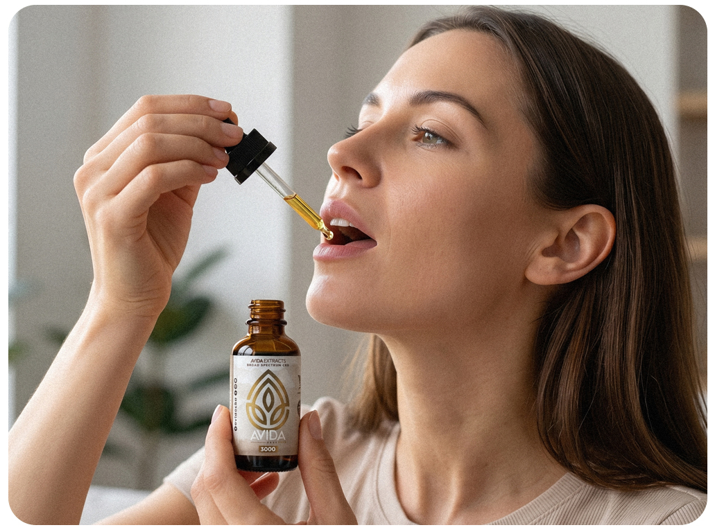 woman_taking_cbd_oil_sublimgually woman taking cbd oil sublingually
