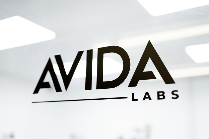 AVIDA Labs - Laboratory Setup with CBD Vape Pen Products and Equipment Displayed on the Counter.