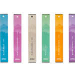 Six AVIDA's Disposable CBD vape pens lined up vertically, showcasing the colorful packaging of flavors including Blue Razz, Kiwi Strawberry, Flavorless, Mint, Manga Mango, and Berry Grape.