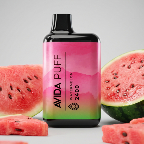 AVIDA Puff Watermelon 2400mg CBD vape with vibrant packaging, complemented by fresh watermelon slices, highlighting a nicotine-free, terpene-infused pen.