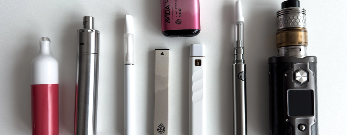 different types of vape pens on a white table