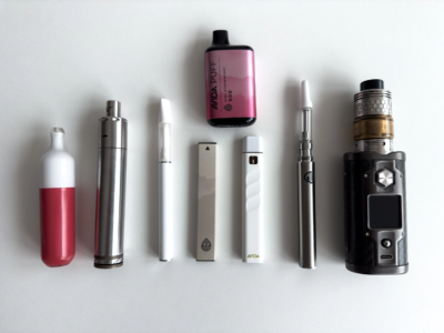 different types of vape pens on a white table